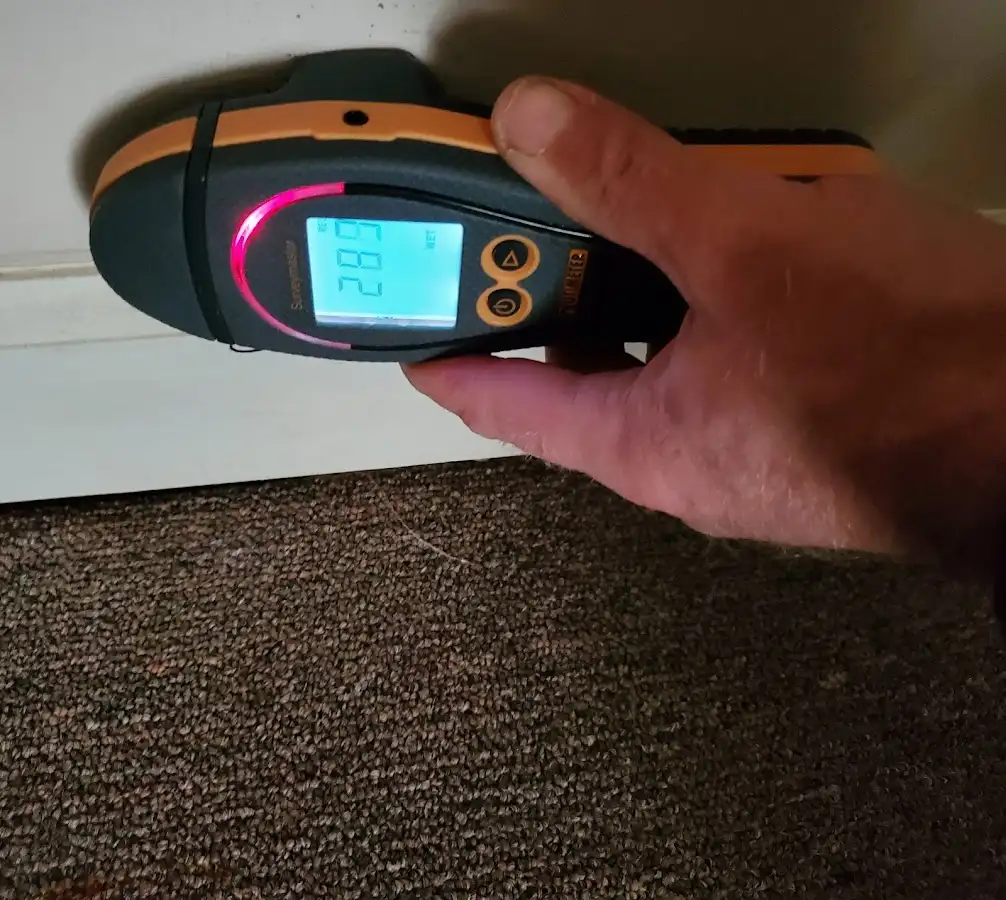 Moisture detection at baseboard during Storm Damage Restoration in Aberdeen